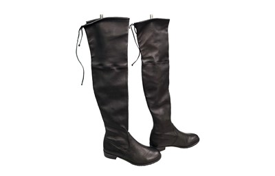 Lot 473 - A PAIR OF STUART WEITZMEN LEATHER BOOTS, with...