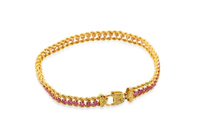 Lot 301 - A GOLD DOUBLE ROPE LINK BRACELET, set with...
