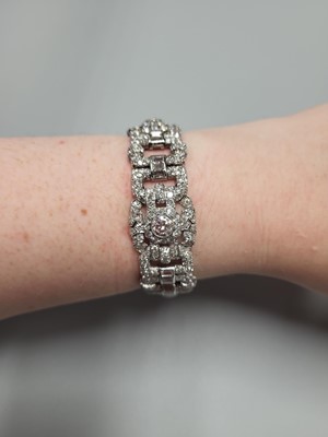 Lot 225 - A DIAMOND SET ART DECO STYLE PANEL BRACELET,...
