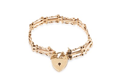 Lot 198 - A VINTAGE 9CT GOLD GATE BRACELET, with padlock...