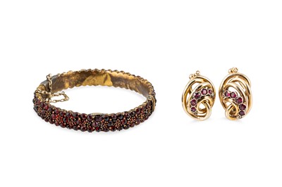Lot 239 - A PAIR OF GOLD EARRINGS, set with garnets,...