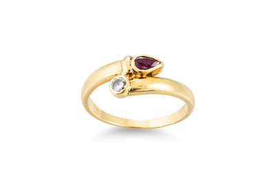 Lot 190 - A RUBY AND DIAMOND RING, cross-over style,...