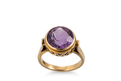 Lot 219 - A 9CT YELLOW GOLD AMETHYST SET DRESS RING,...