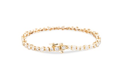 Lot 168 - A DIAMOND LINE BRACELET, the round brilliant...