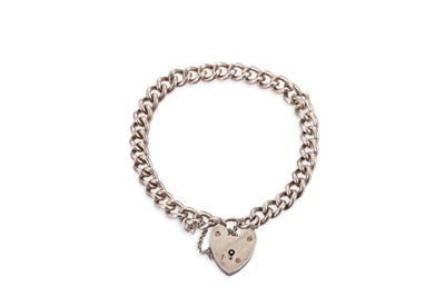 Lot 29 - AN ANTIQUE SILVER CURB LINK BRACELET, with...