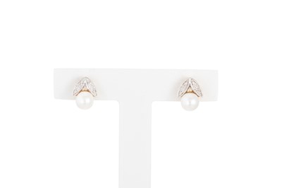 Lot 34 - A PAIR OF DIAMOND AND PEARL EARRINGS, mounted...