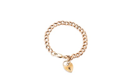 Lot 175 - A 9CT GOLD CURB LINK BRACELET, with padlock...