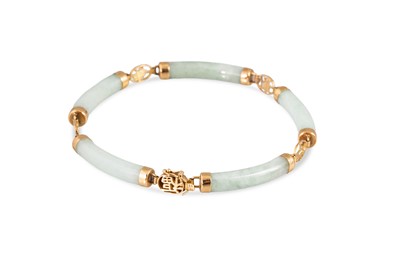 Lot 180 - A JADE BRACELET, the cylindrical shaped jade...