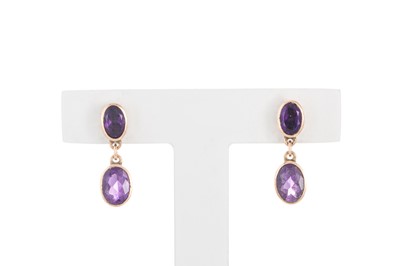 Lot 56 - A PAIR OF AMETHYST DROP EARRINGS, the oval...