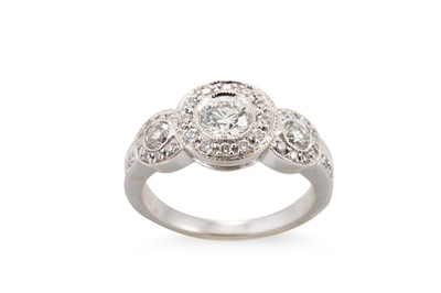 Lot 127 - A DIAMOND TRIPLE CLUSTER DRESS RING, mounted...