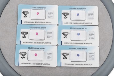 Lot 96 - THREE LOOSE SAPPHIRES AND THREE RUBIES, sealed...