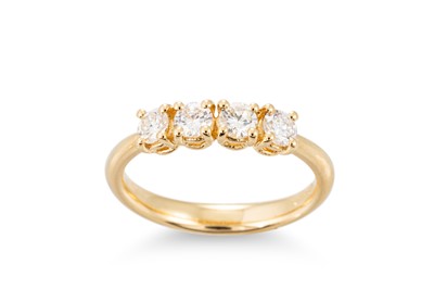 Lot 369 - A DIAMOND FOUR STONE RING, mounted in 18ct...