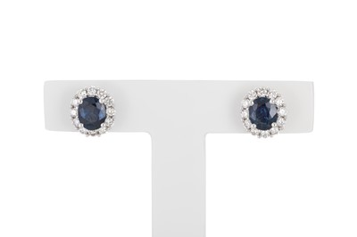 Lot 381 - A PAIR OF SAPPHIRE AND DIAMOND EARRINGS, the...