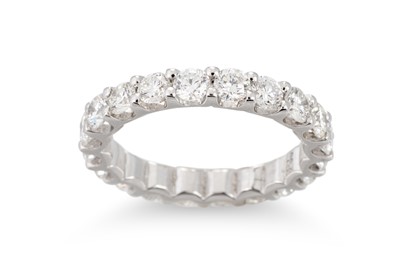 Lot 384 - A DIAMOND FULL BANDED ETERNITY RING, mounted...