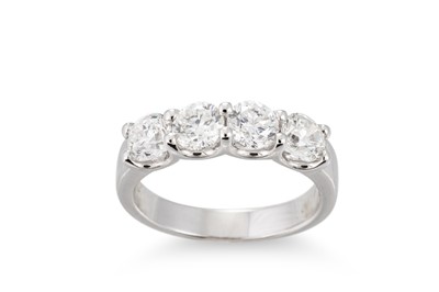 Lot 385 - A FOUR STONE DIAMOND RING, mounted in 18ct...