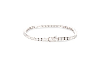 Lot 387 - A DIAMOND LINE BRACELET, the round brilliant...