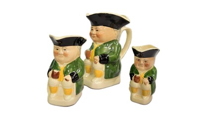 Lot 545 - THREE TOBY JUGS, graduated sizes