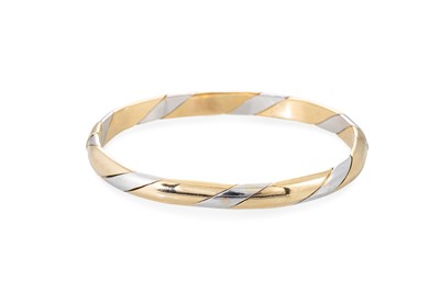 Lot 314 - A THREE COLOUR 9CT GOLD BANGLE, twist form, 18....