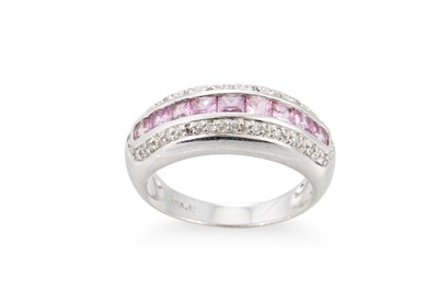 Lot 113 - A DIAMOND AND PINK SAPPHIRE BAND RING, the...