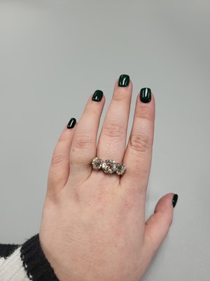 Lot 283 - A DIAMOND THREE STONE RING, the old cut...