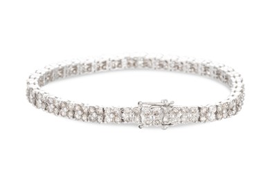 Lot 337 - A DIAMOND CLUSTER BRACELET, mounted in 18ct...