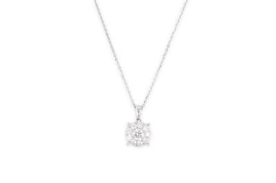 Lot 338 - A DIAMOND CLUSTER PENDANT, the brilliant cut...
