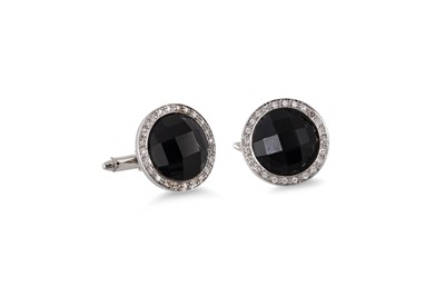 Lot 267 - A PAIR OF ONYX AND DIAMOND CUFF LINKS, mounted...