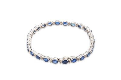Lot 139 - A SAPPHIRE AND DIAMOND BRACELET, each oval...
