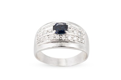 Lot 142 - A SAPPHIRE AND DIAMOND RING, the oval sapphire...