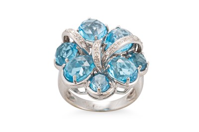 Lot 320 - A TOPAZ AND DIAMOND CLUSTER RING, of abstract...