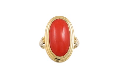 Lot 307 - A CORAL RING, the oval cabochon mounted in...