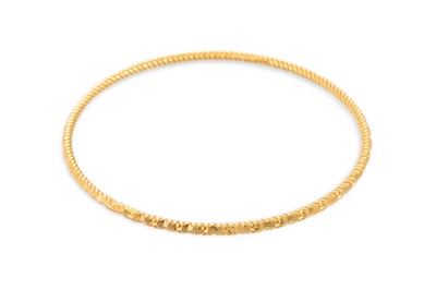 Lot 381 - A YELLOW GOLD BANGLE, with Arabic hallmark,...