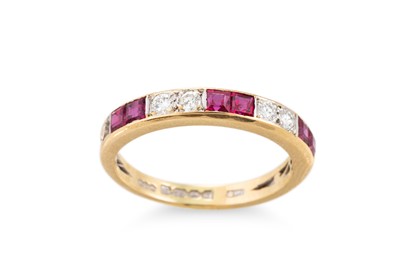 Lot 267 - A RUBY AND DIAMOND SET BAND RING, the channel...
