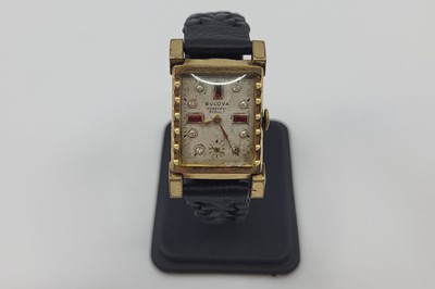 Lot 433 - A BULOVA UNISEX WRISTWATCH, gem-set markers &...
