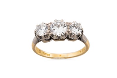 Lot 145 - A VINTAGE THREE STONE DIAMOND RING, mounted in...