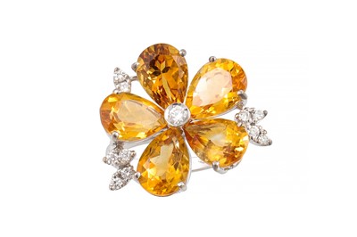 Lot 340 - A CITRINE AND DIAMOND DRESS RING, in the form...
