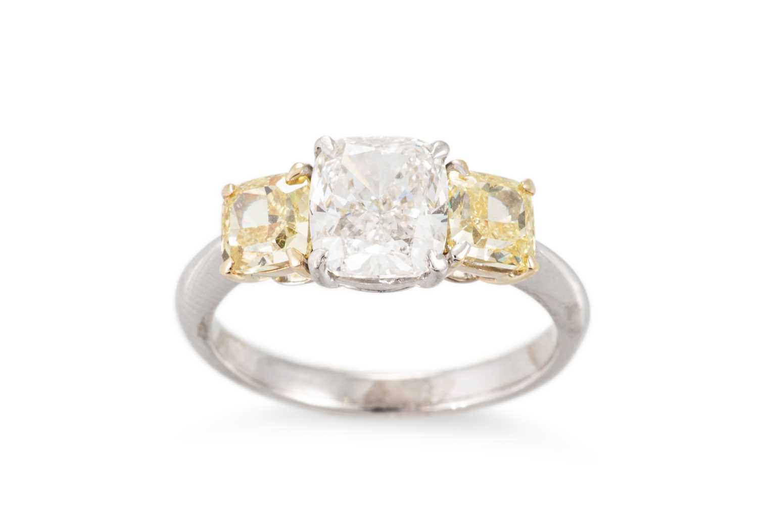 Lot 312 - A FANCY VIVID YELLOW AND WHITE DIAMOND THREE...