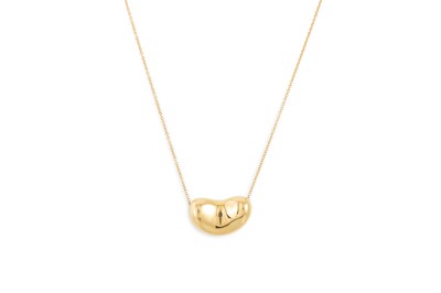 Lot 306 - AN 18CT GOLD TIFFANY BEAN PENDANT, by Elsa...