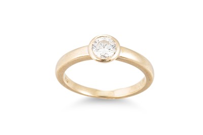 Lot 327 - A DIAMOND SOLITAIRE RING, the bezel set...