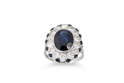 Lot 337 - A SAPPHIRE AND DIAMOND CLUSTER RING, the oval...