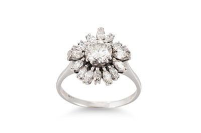 Lot 344 - A DIAMOND CLUSTER RING, the central brilliant...