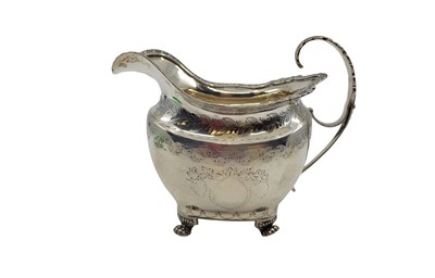 Lot 488 - A GEORGE III IRISH SILVER MILK JUG, egg & dart...