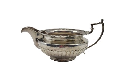 Lot 490 - A GEORGE III IRISH SILVER MILK JUG, egg & dart...