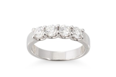 Lot 165 - A DIAMOND FOUR STONE RING, the round brilliant...