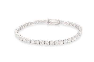 Lot 353 - A DIAMOND LINE BRACELET, the round brilliant...