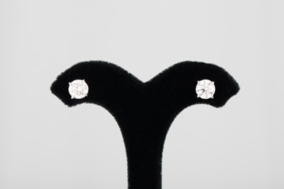 Lot 354 - A PAIR OF DIAMOND STUD EARRINGS, the round...