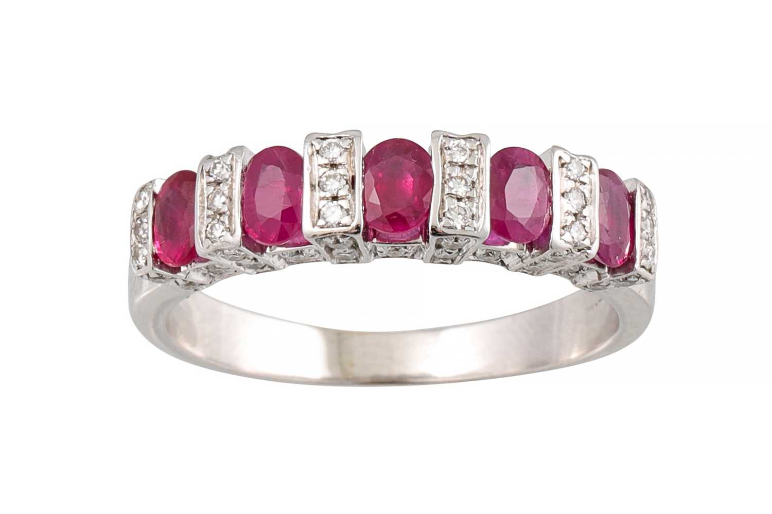 Lot 377 - A RUBY AND DIAMOND DRESS RING, the oval rubies...
