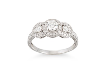 Lot 348 - A DIAMOND TRIPLE CLUSTER RING, the brilliant...