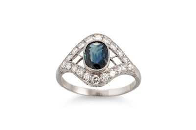 Lot 244 - A SAPPHIRE AND DIAMOND CLUSTER RING, the oval...