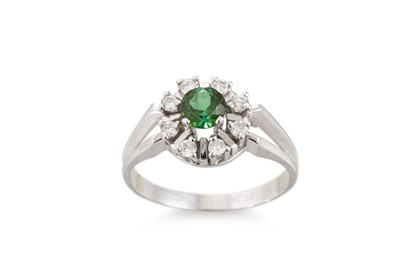 Lot 280 - A TOURMALINE AND DIAMOND CLUSTER RING, mounted...